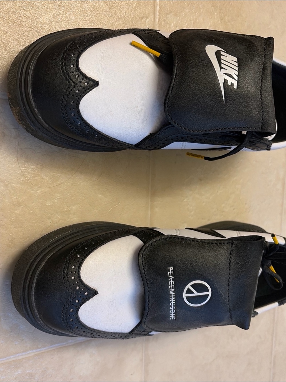 Nike Black and White Sneakers with Yellow Accents